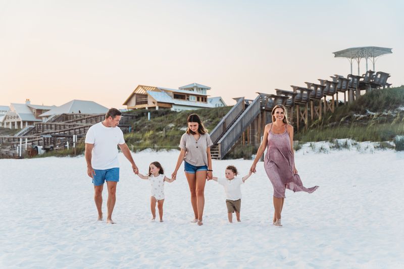 Family walking on a beach in Seaside 30a, Florida