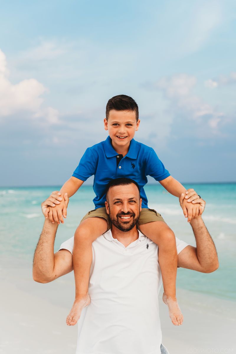 Dad with son on his shoulders