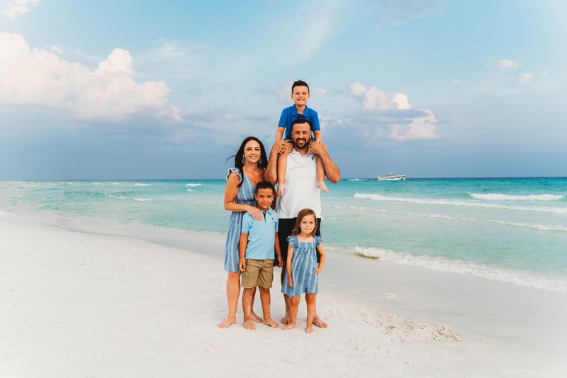 family of 5 on a beach at Destin, Florida