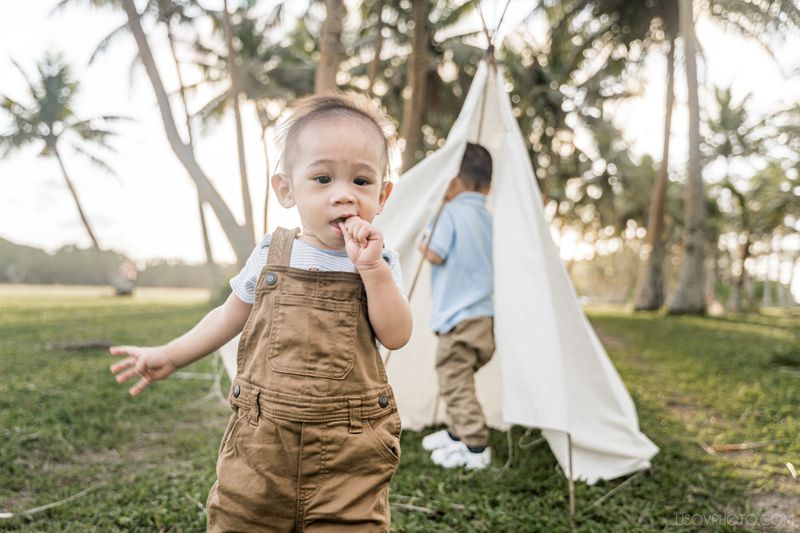 two kids playing on a family photoshoot 