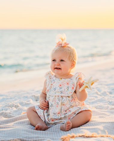 baby girl on a beach